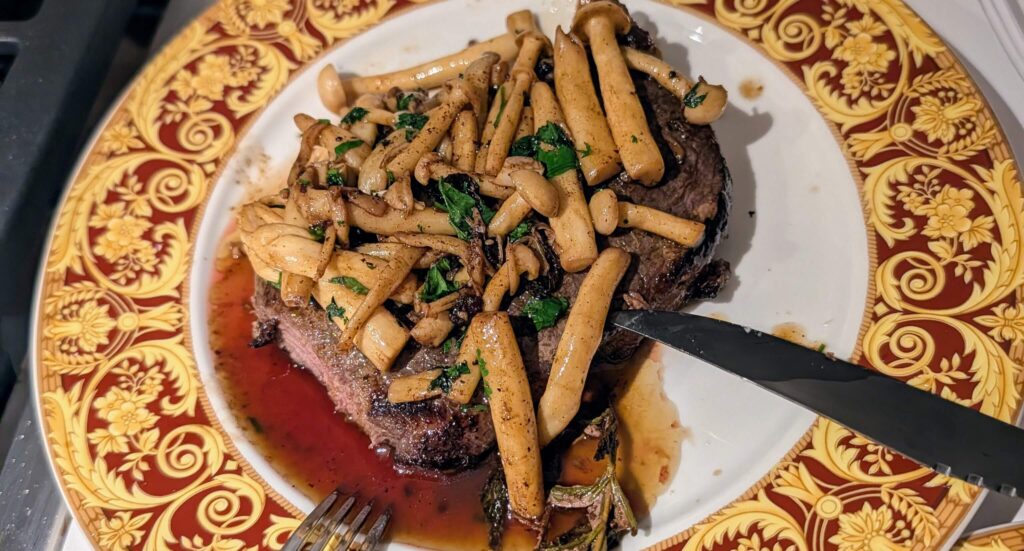 11ish enoki mushrooms on strip steak