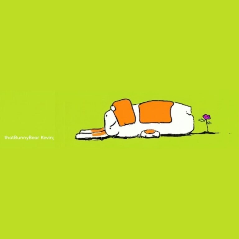 Kev the white bunny bear lies flat on his back on a chartreuse field next to a small purple flower, resting or maybe fallen.